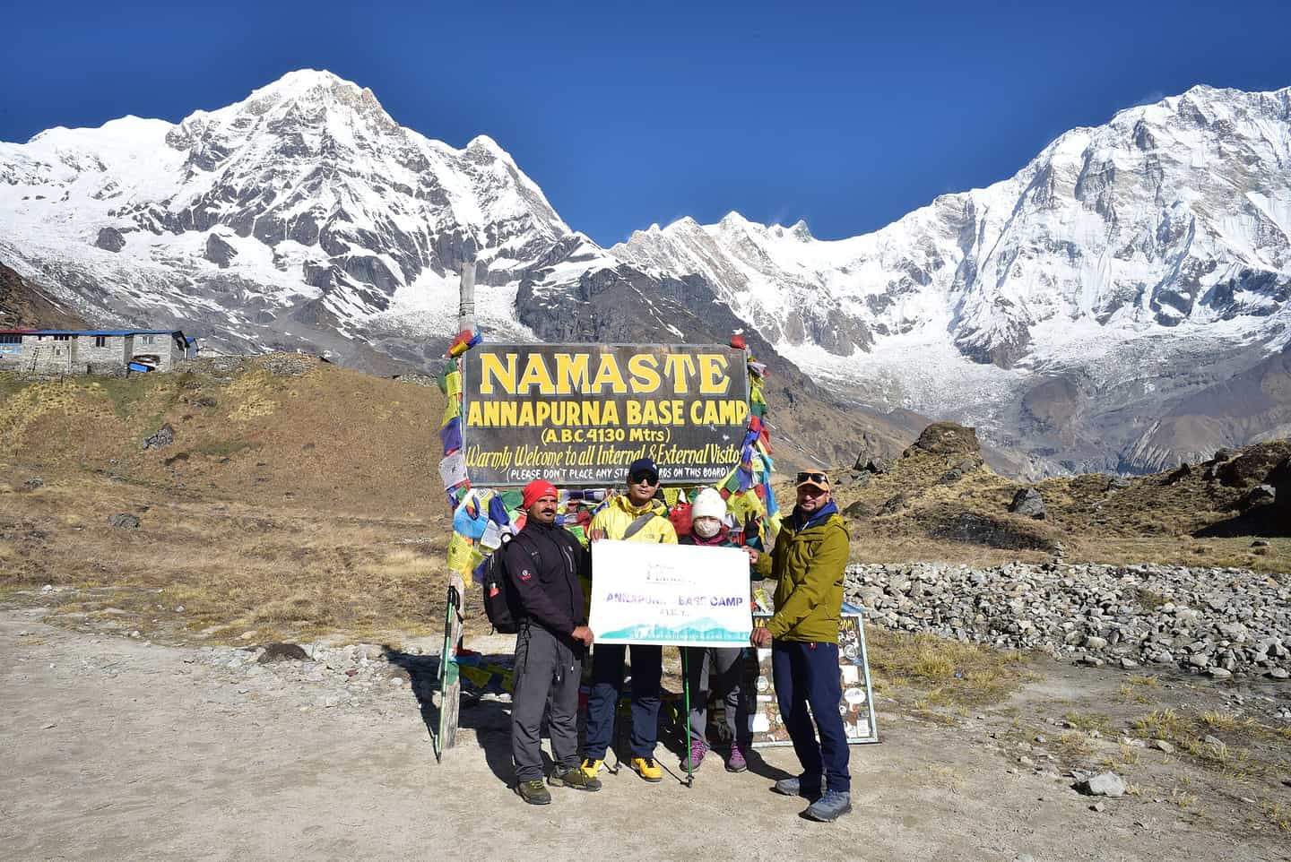 Trekkers celebrating at Annapurna Base Camp with their Tripnep guide